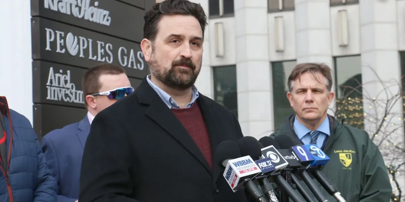 Illinois PIRG Director Abe Scarr speaks to reporters on Jan. 6, 2026, at a demonstration protesting a Peoples Gas rate hike request to the Illinois Commerce Commission.