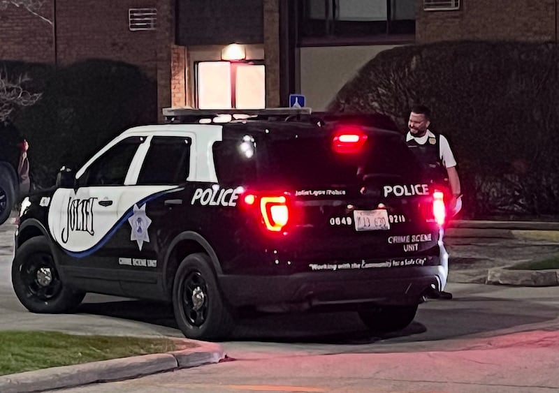 A Joliet Police Department vehicle on Thursday, April 9, 2026, at Larkin Village apartments in Joliet.