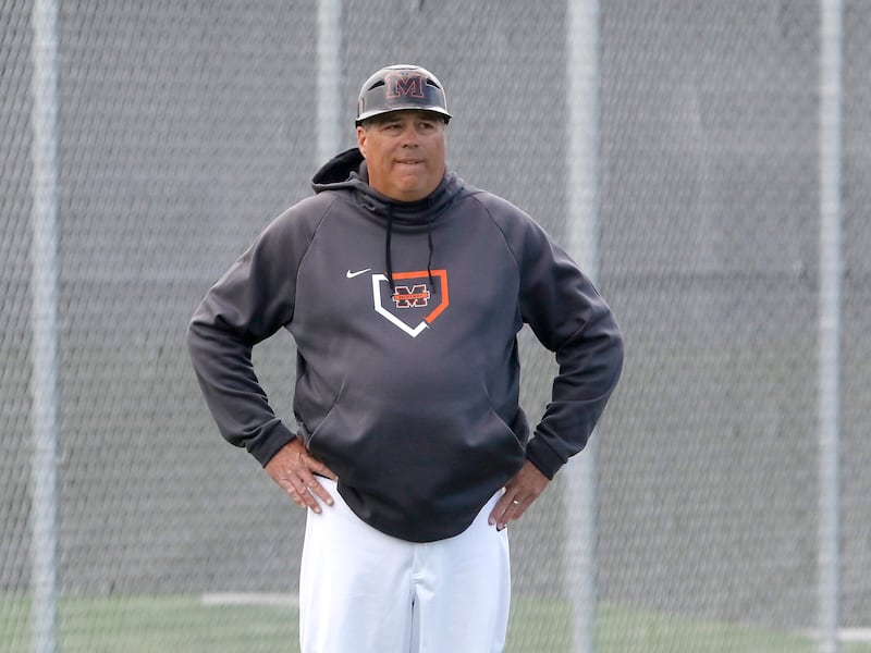 McHenry Head Baseball Coach Brian Rockweiler keeps an eye on the game during a Fox Valley Conference baseball game against Crystal Lake Central on Friday, May 2, 2025, at McHenry High School.