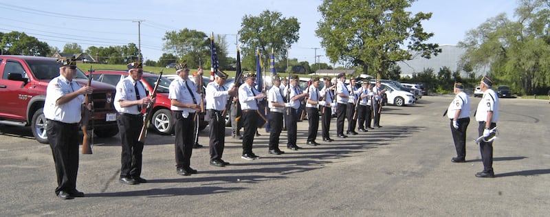 Honor guard members prepare for Rock Falls American Legion Post's Memorial Day ceremony at Lower Dam Park in Rock Falls on Monday, May 26, 2025.