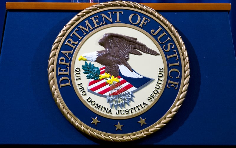 FILE - The Department of Justice seal is seen in Washington, Nov. 28, 2018. (AP Photo/Jose Luis Magana, File)
