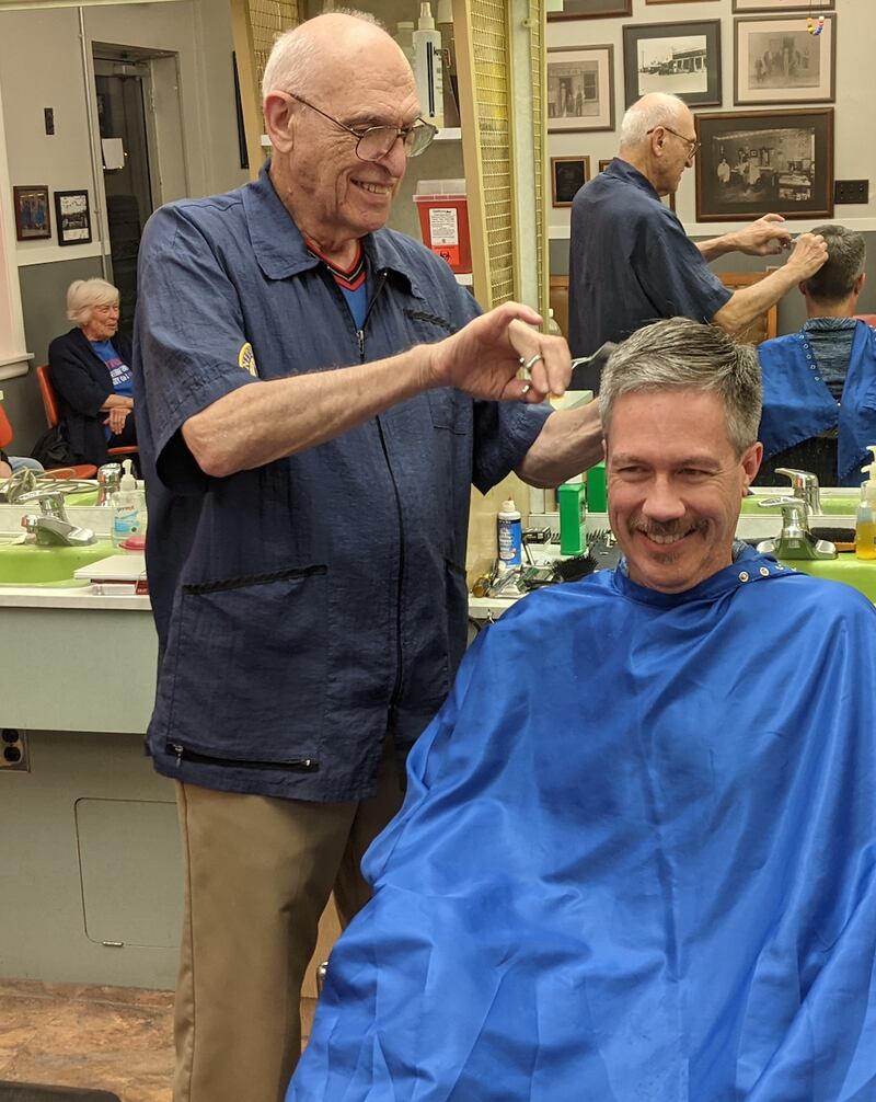 Lincolnway Barbershop barber Jim Ganta gives the last haircut at the Plainfield shop to longtime customer Chris Porro of Crest Hill. Lincolnway Barbershop closed its doors on Nov. 5, 2025.