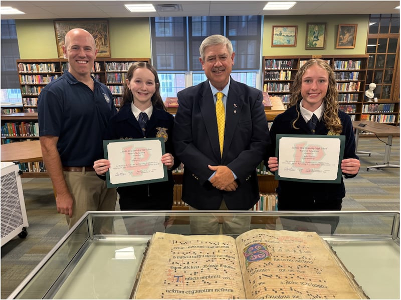 Riley Hinzsche (L-P Agriculture Instructor, FFA Advisor), Ella Crane, Greg Sarver (Board President), Mollie Thomson celebrated Crane's and Thomson's achievements on Wednesday, May 20, 2026, at a meeting of the La Salle-Peru Township High School District 120 Board of Education.