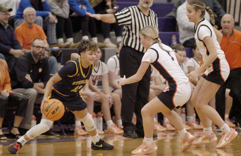 Joslynn James comes up against Byron defense. The Sterling Golden Warriors played the Byron Tigers in the championship game of the Dixon Holiday Tournament at Dixon High School on Monday, December 29th, 2025.