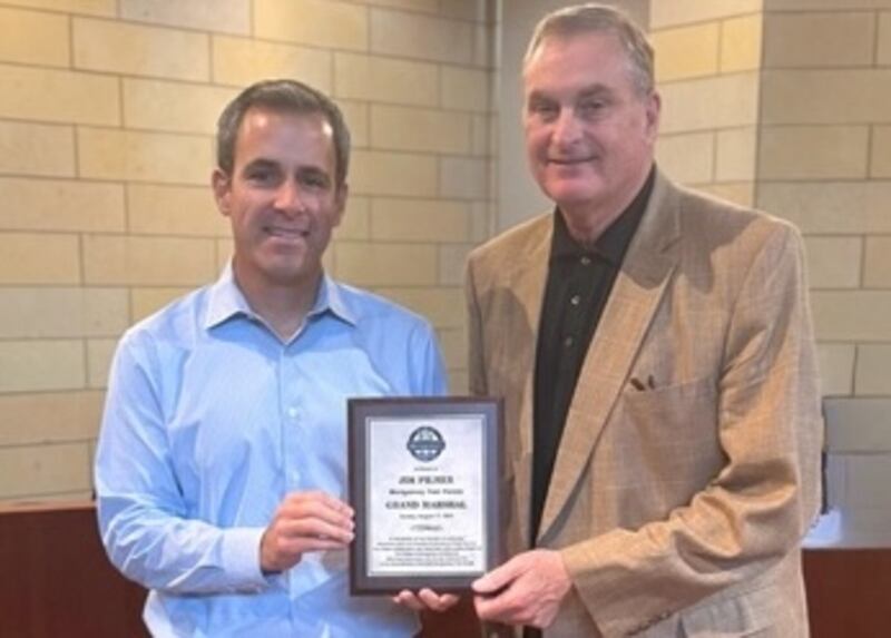 Montgomery Village President Matt Brolley (right) with Jim Pilmer, grand marshal of the 2025 Montgomery Fest parade.