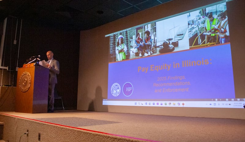 Jason Keller, assistant director of the Illinois Department of Labor, speaks at a seminar about recent findings of a report on pay equity in Illinois. The report is the first released since a 2021 amendment to the Equal Pay Act required certain business owners to report wage and demographic data.