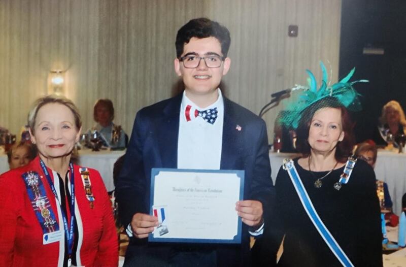 Maximus Gibson (center) with Nancy Gartner, the Daughters of the American Revolution Princeton-Illinois Chapter Regent and Christina Bannon, State Regent.