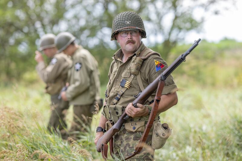 Michael Ralph stands guard on the edge of the American Base Camp on Sunday, July 14, 2024, during the Ottawa Military Show in rural Ottawa.