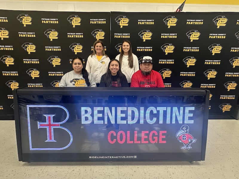 Putnam County senior Valeria Villagomez signs to play softball at Benedictine College in Kansas. She said she was drawn most to Benedictine "because of its values and opportunities to further both my academic and athletic career. I’m beyond grateful for everything that has lead me down this path and I can’t wait for these next four years." Villagomez, who received NewsTribune all-area honorable mention honors in 2024, was joined for her signing by her mother, Laura Mendez (front row) and father, Rodolfo Villagomez; and (back row)
PC assistant coach Lynette Olson and PC head coach Adrianna Zeman.