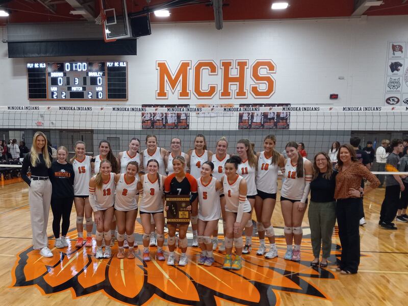 The Minooka volleyball team celebrates their win over Bradley-Bourbonnais in the IHSA Class 4A Minooka Regional championship on Oct. 30, 2025.