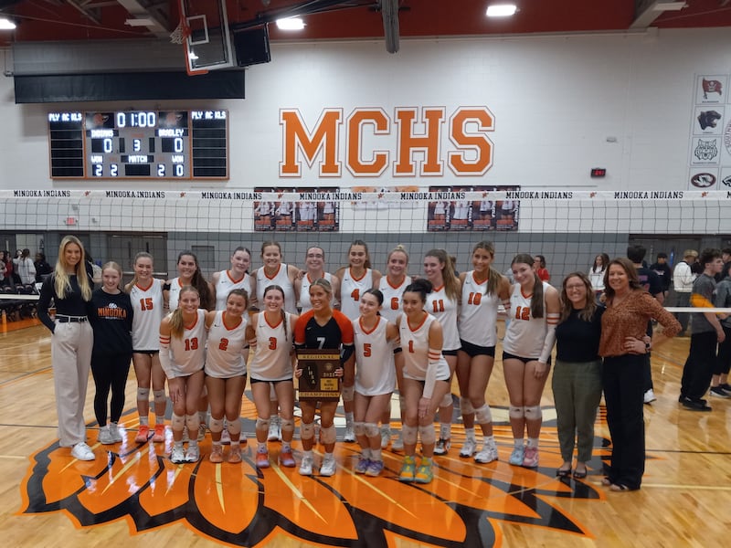 The Minooka volleyball team celebrates their win over Bradley-Bourbonnais in the IHSA Class 4A Minooka Regional championship on Oct. 30, 2025.