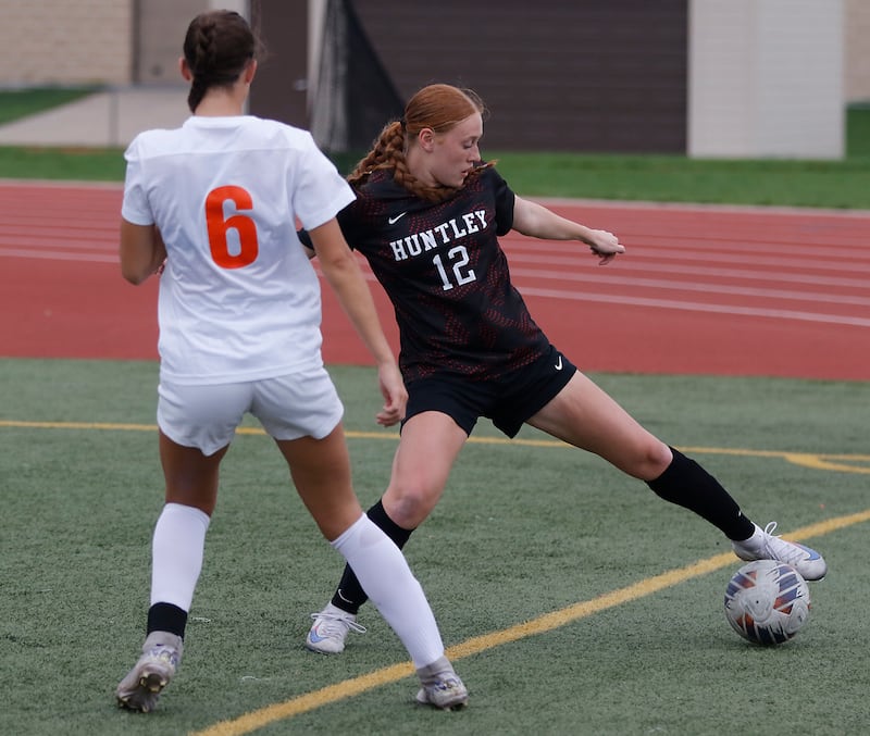 Huntley's Avery Suess (right) tries to control the ball in front of Crystal Lake Central's Ella Bechler during a Fox Valley Conference soccer match on Tuesday, April 14, 2026, at Huntley High School.