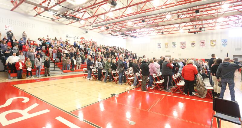 Veterans stand to be recognized as students and staff fill the gymnasium during the Veterans Day program on Tuesday, Nov. 11, 2025 at Parkside Middle School in Peru.