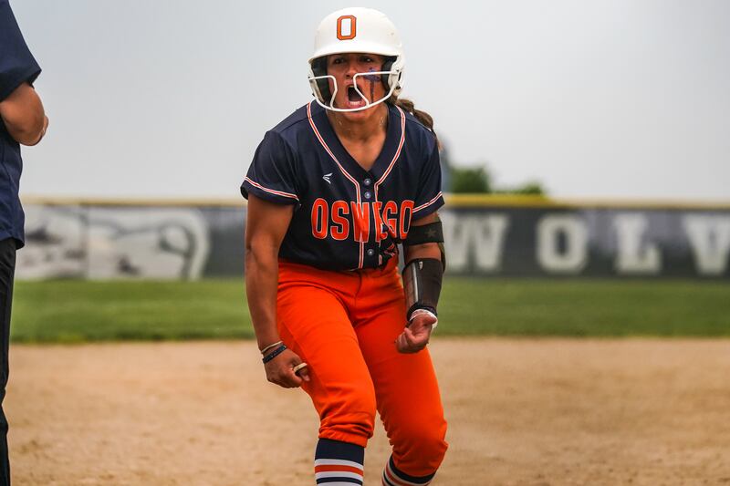 Oswego’s Kiyah Chavez (10) reacts after hitting an RBI triple against Neuqua Valley during a Class 4A Oswego East Regional Final softball game at Oswego East High School on Friday, May 30, 2025.