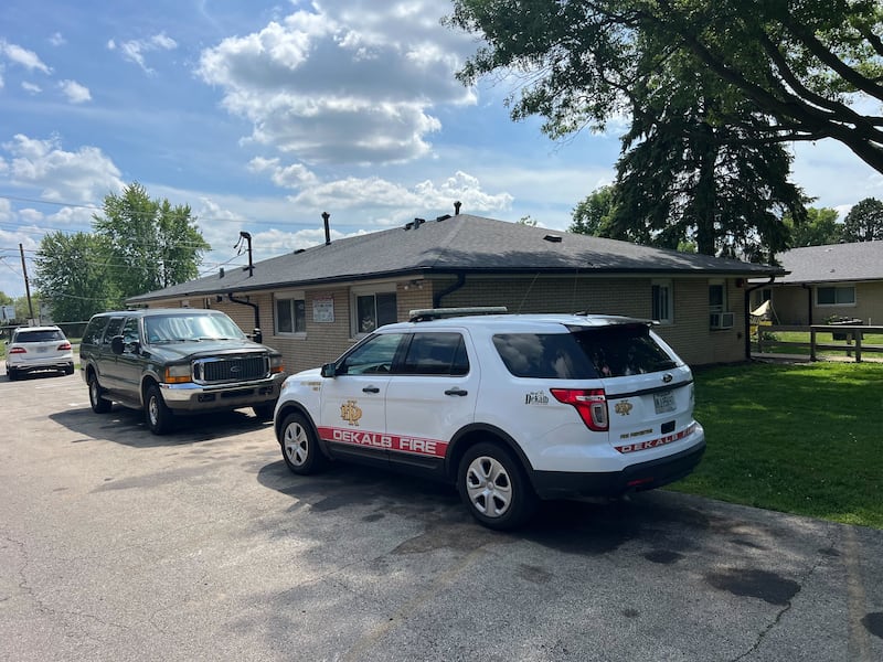A DeKalb Fire Department chief's vehicle sits outside 908 Greenbrier Road, DeKalb, on Tuesday, June 17, 2025. A fire started in the early morning in a bathroom, leaving the building uninhabitable, injuring one person and displacing 16 residents, authorities said.