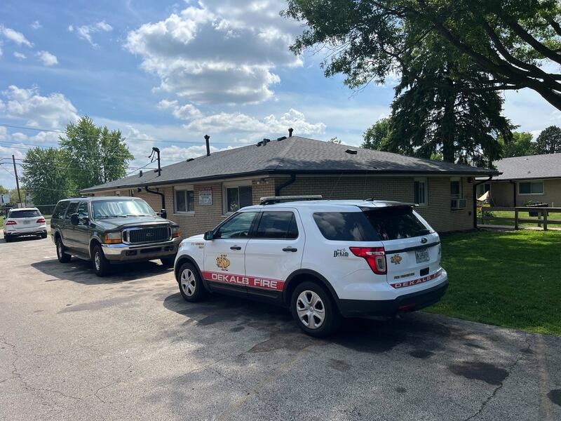 A DeKalb Fire Department chief's vehicle sits outside 908 Greenbrier Road, DeKalb, on Tuesday, June 17, 2025. A fire started in the early morning in a bathroom, leaving the building uninhabitable, injuring one person and displacing 16 residents, authorities said.
