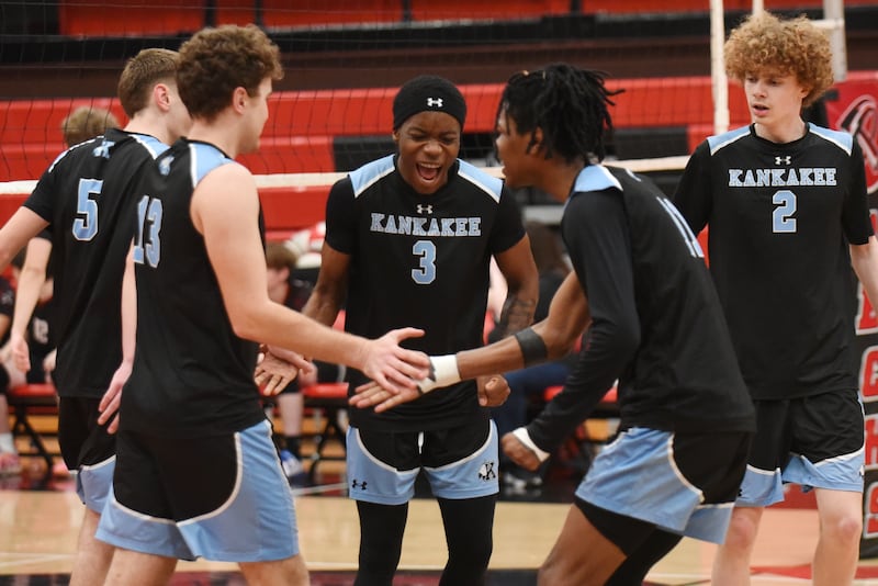 Kankakee's Jamon Barlow, center, and his Kays boys volleyball teammates celebrate a point in the third set of their 2-1 win at Bradley-Bourbonnais Thursday, April 9, 2026.