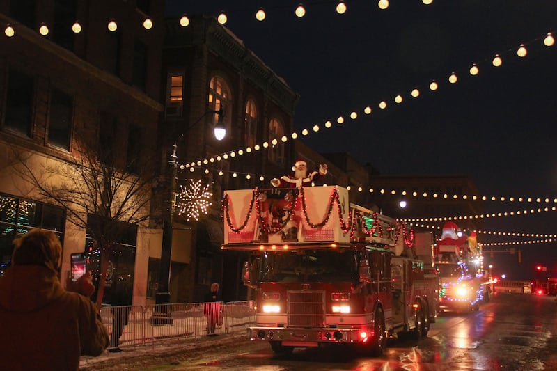 Santa Claus waves to the crowd from the top of a Kankakee fire truck to end the Kankakee Christmas Parade on Saturday, Dec. 13, 2025.