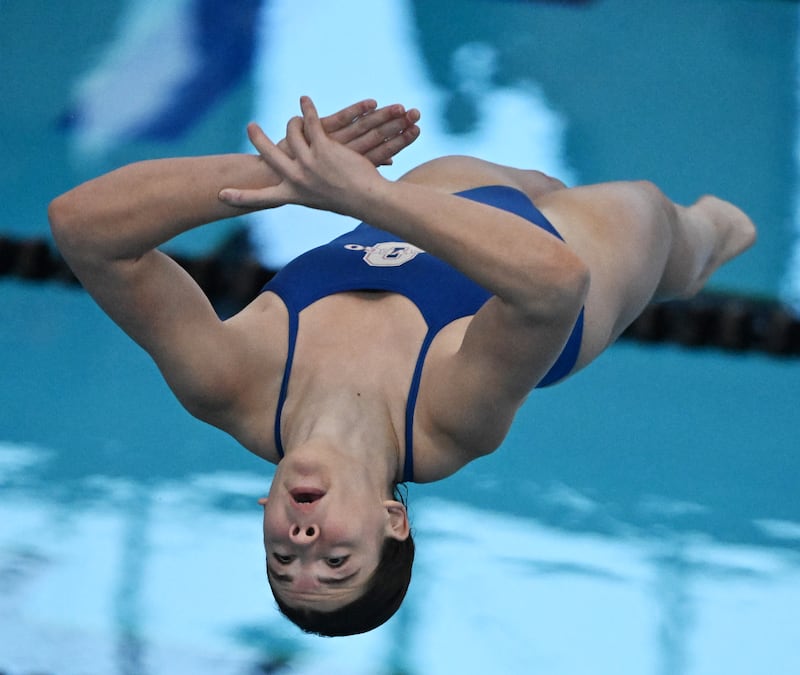 Oswego’s Katie Malm competes on her way to a state championship in diving during the girls state swimming and diving finals at the FMC Natatorium on Saturday, Nov. 15, 2025 in Westmont.