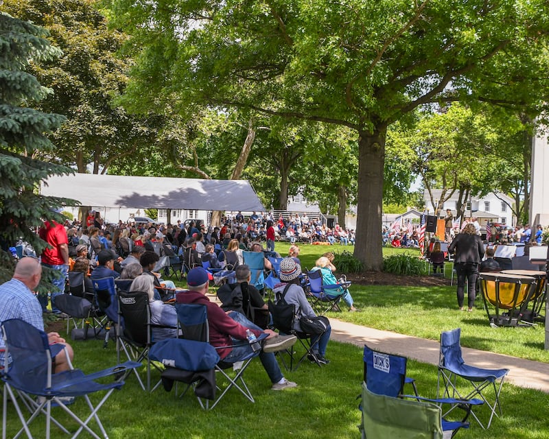 Attendees listen to Masters Sargent Devin Persaud speak during the Memorial Day event on Monday May 26, 2025, held at Town Square Park in Yorkville.