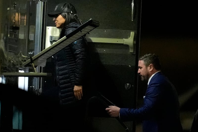 Director of National Intelligence Tulsi Gabbard, left, and FBI Deputy Director Andrew Bailey, enter a command vehicle as the FBI takes Fulton County 2020 Election ballots, Wednesday, Jan. 28, 2026, in Union City, Ga., near Atlanta. (AP Photo/Mike Stewart)