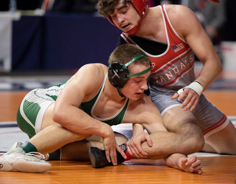Coal City’s Aidan Kenney works on the leg of Vandalia’s Dillon Hinton in the 1A 157 pound class Saturday, Feb. 21, 2026, at the IHSA wrestling finals in Champaign.