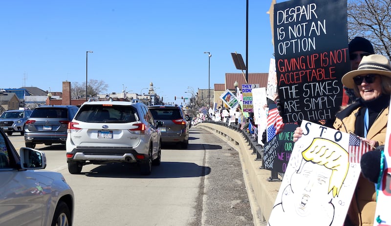 Hundreds of people lined the Route 38 bridge over the Fox River in support of International Women’s Day in Geneva on Saturday, March 8th, 2025.
