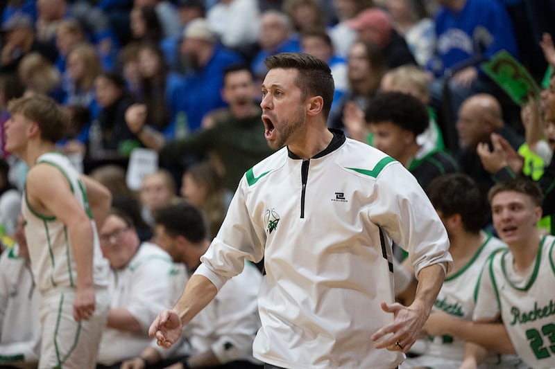 Rock Falls coach Zach Sandrock cheers on his team as the clock ticks down against Princeton Friday, March 7, 2025, in the Class 2A boys basketball Sectional final in Marengo.