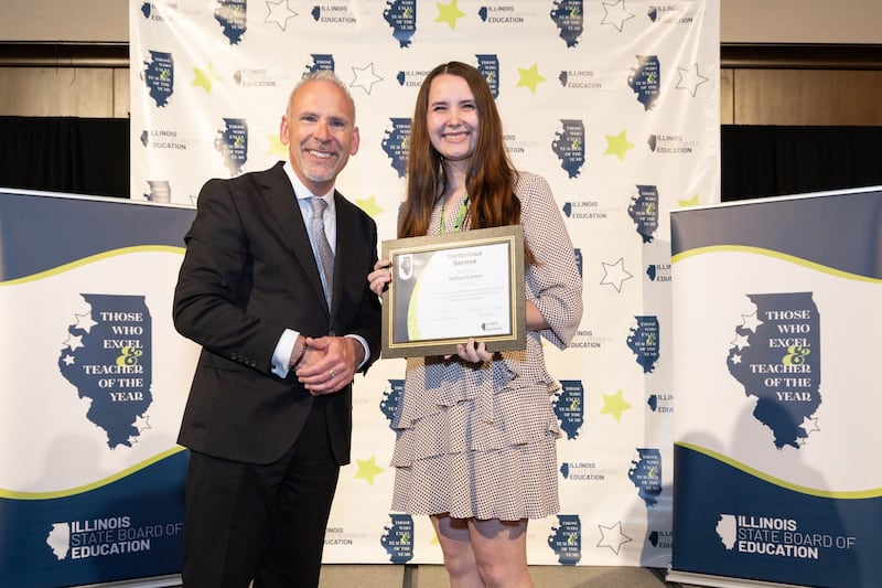 McHenry Community High School teacher Kathryn Larson received an award for Meritorious Service as an early-career educator at the 2026 Those Who Excel and Teacher of the Year Awards in Normal.