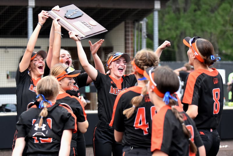 Members of the Beecher softball team celebrate with their Class 2A Seneca Sectional championship plaque after defeating Seneca 1-0 Friday, May 30, 2025, in Seneca.
