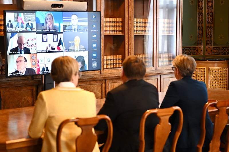 Britain's Foreign Secretary Yvette Cooper, right, attends a virtual summit at the Foreign & Commonwealth Office in London, on Thursday April 2, 2026, with around 35 countries to discuss ways of reopening the Strait of Hormuz. (Leon Neal/Pool Photo via AP)