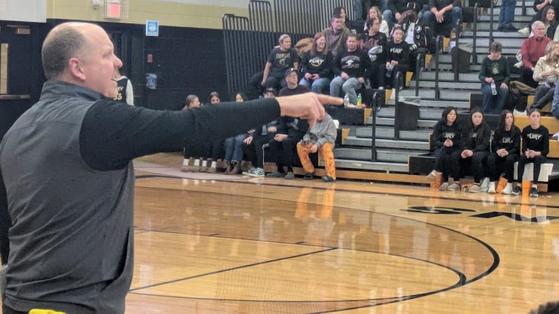 Sycamore coach Adam Wickness directs his team on defense during the Spartans' 56-51 loss to Kaneland on Friday, December 12, 2025.