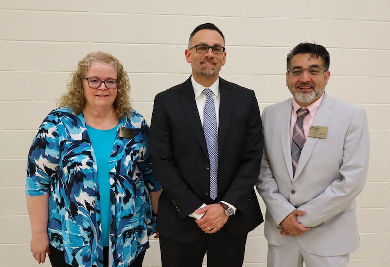 New Assistant Superintendent for Human Resources Jose Jaramillo stands between Joliet Public Schools District 86 Superintendent Dr. Theresa Rouse and Board of School Inspectors President Jesse Smith on May 18, 2026.