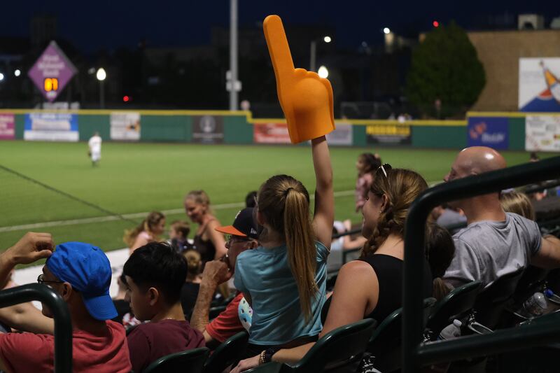 A fan wears a foam finger while cheering on the Joliet Slammers at the home opener against the Ottawa Titans. Friday, May 13, 2022, in Joliet.