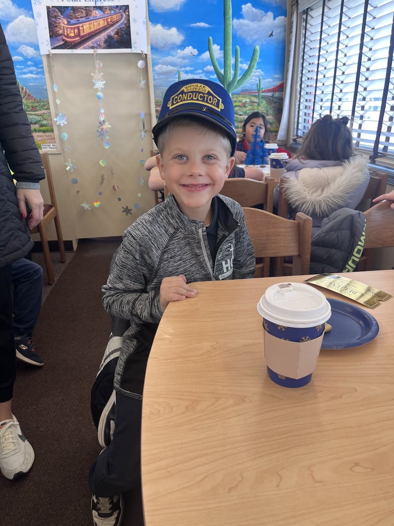 Holy Cross kindergartner Randy Fox enjoys the 61342 Christmas Express on Dec. 17.