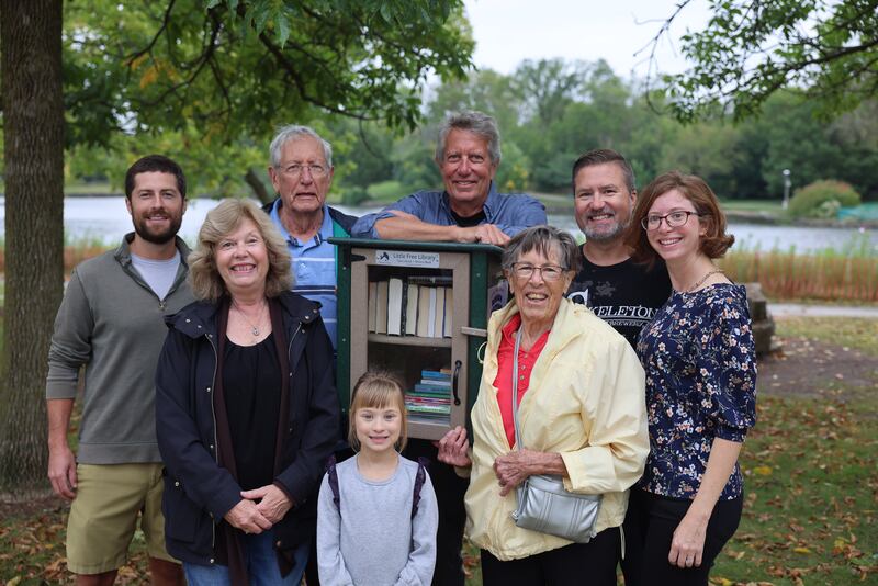 Children and grandchildren of  Bruce and Reta Nagle celebrate the couple's 90th birthday with the installation of a Little Free Library near Barth Pond in Downers Grove's Patriots Park.