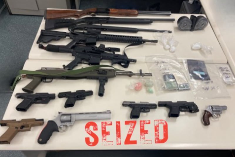 The Aurora Police Department posted an image of weapons seized during an investigation. Officers recovered 13 firearms, including AR-15 style rifles, a sawed-off rifle, shotguns and handguns.