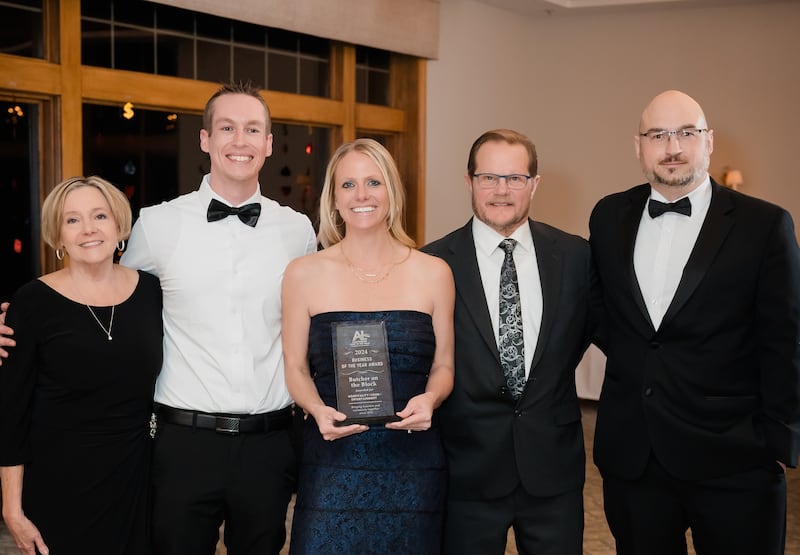 Butcher on the Block butcher shop in Lake in the Hills receives an award from the Algonquin-Lake in the Hills Chamber of Commerce in January 2025. From left are owner Jill Yucuis; employee Brandon Northcutt; Brynn Zimmerman, daughter of Tom and Jill Yucuis and general manager; Tom Yucuis; and Greg Urban, executive director of the chamber. Tom Yucuis died Feb. 24, 2025, after he was hit by cars while driving.