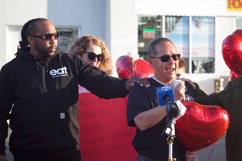 Former Joliet Township Trustee Karl Ferrell (left), comforts David Palacios, the father of David Malito, 39, at a prayer vigil and protest for Malito on Monday, May 5, 2025, at the Shell gas station, 401 S. Larkin Avenue, Joliet.