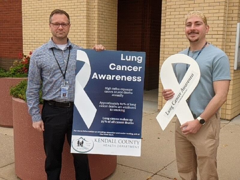 Aaron Rybski, environmental health services director for the Kendall County Health Department, left, and Kendall County Health Department care coordinator Miguel Hernandez, right, talk about the department's efforts to prevent lung cancer.