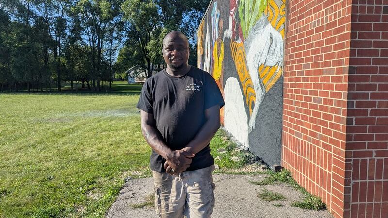 Jelili “Larry” Olaniyan stands near a mural on the side of the future O’Larry Asun Spot, at 3109 Theodore St. in Joliet, a halal restaurant that will feature West African dishes, on Monday, June 23, 2025. Olaniyan hired Uprizn Ikpemi of South Holland, a Nigerian-born American visual artist, to create the mural along with interior art for the restaurant.