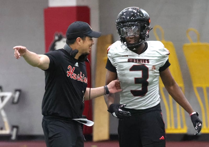 Northern Illinois’ Jacob Finley gets some instruction from an assistant coach Wednesday, July 30, 2025, at the teams first practice of the season in the Chessick Practice Center at NIU in DeKalb.
