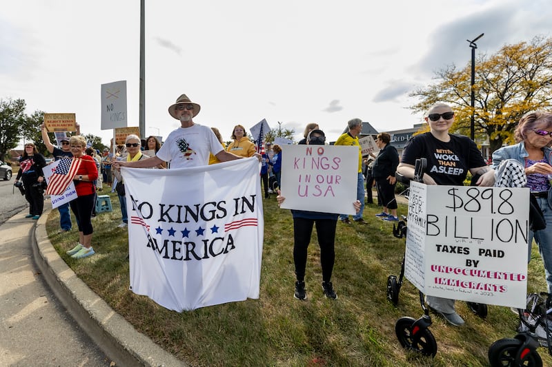 Protestors line Plainfield Road in Joliet during the No Kings Protest in Joliet on Oct. 18, 2025.