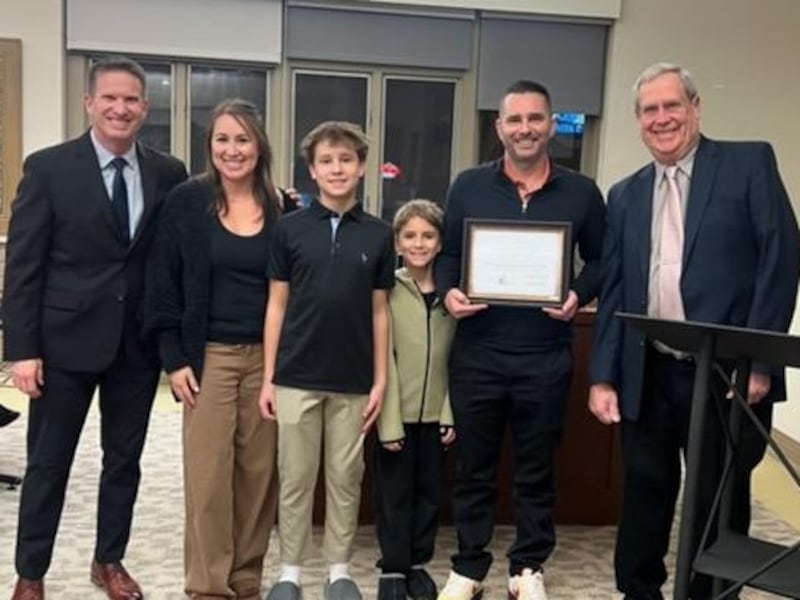 Founder of The Hairy Ant, Anthony Harrison (second right) poses with his family after receiving a Spirit of St. Charles Award at the City Council meeting on Feb. 2. Also pictured, Alderperson Mark Foulkes (far left) and Alderperson Ronald Silkaitis (far right).