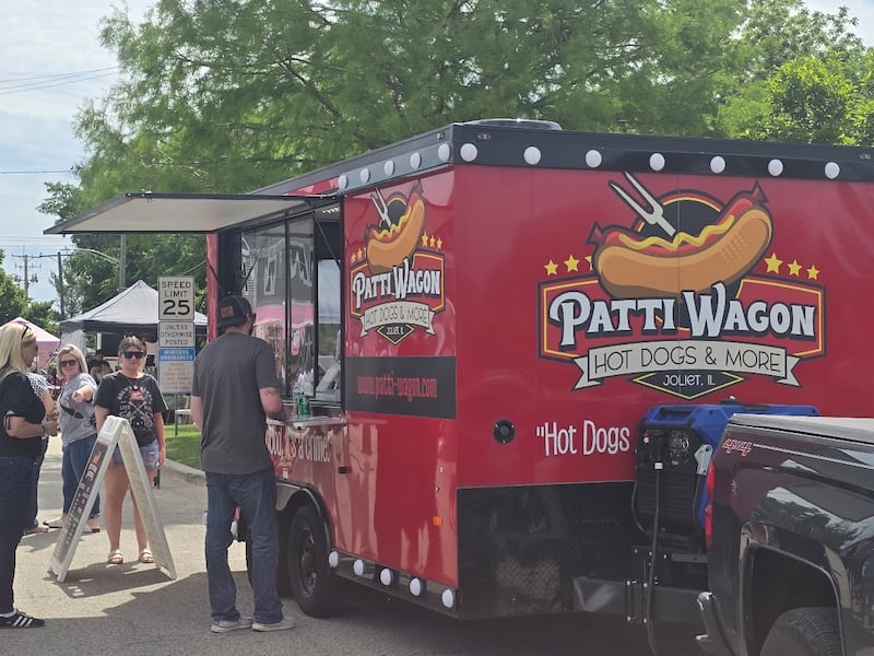 Customers line up to buy food from Patti Wagon Hot Dogs & More at The Vintage Faire in Minooka, on Sunday, May 31, 2026.