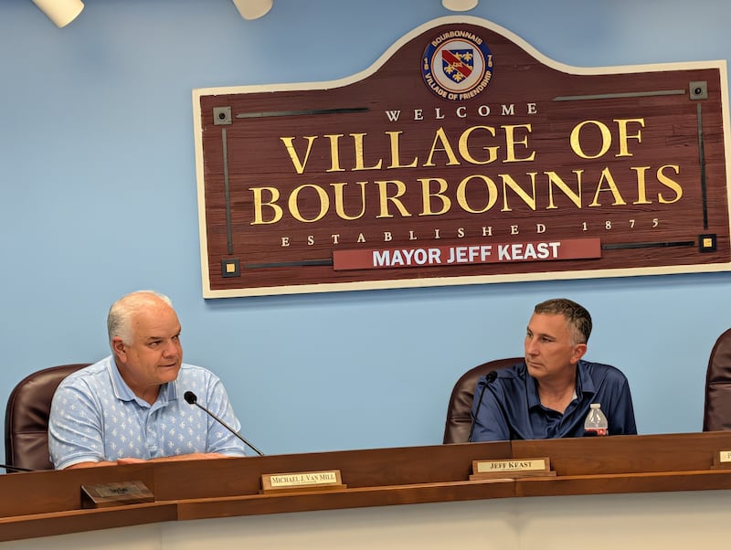 Bourbonnais Administrator Mike Van Mill (left) and Mayor Jeff Keast discuss a proposed moratorium on data centers in the village during a meeting June 10, 2026.