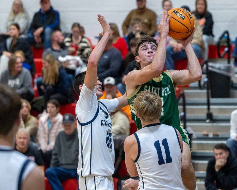 Gino Ferrari (4) of St. Bede shoots lays up ball as Landon Ludwig (22) and Cole Kennedy (11) of Ridgeview attempt to guard on Wednesday, November 26, 2025 at Woodland High School in South Streator.