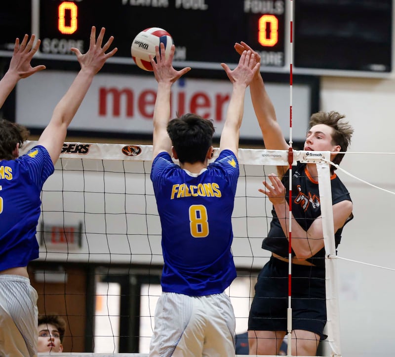 Wheaton Warrenville South's Simon Bratt (10) moves the ball past Wheaton North's Peter Dey (8) during the crosstown boys volleyball match Tuesday, April 28, 2026 in Wheaton.