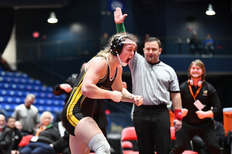Callie Carr of Hinsdale South celebrates her victory over Kiyah Chavez of Oswego in the 155-pound championship match in the IHSA Girls Individual State Finals on Saturday, March 1.