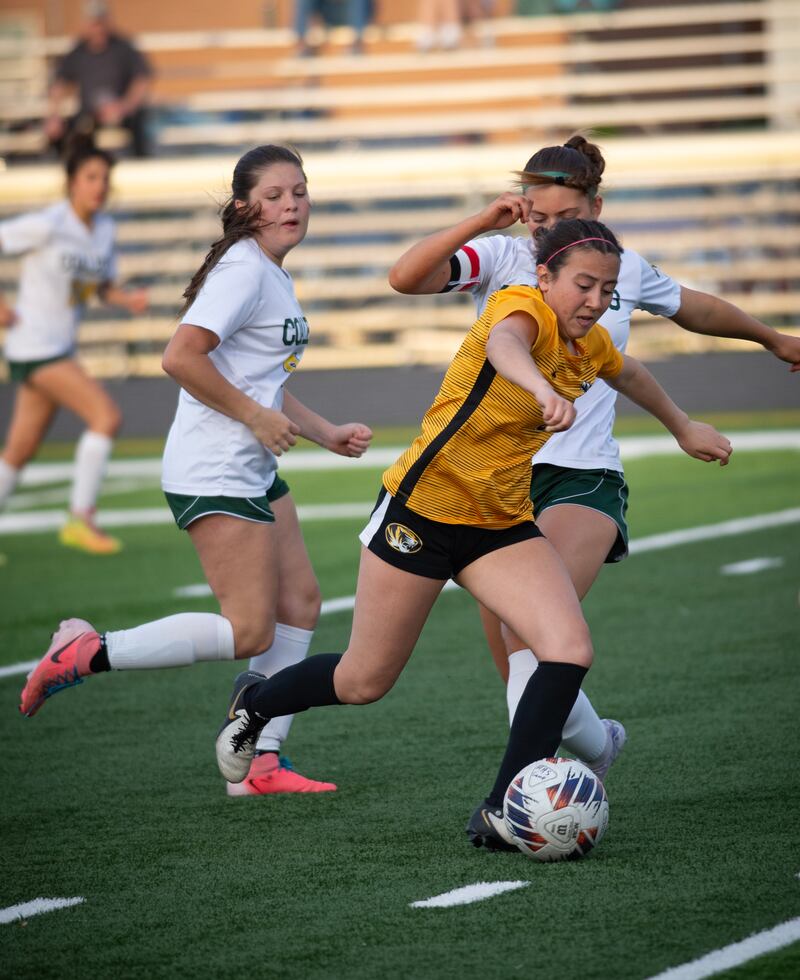 Herscher's Gianni Jaime moves the ball as Coal City's Kylee Kennell steps in to challenge her during the game in Herscher on April 24, 2025.
